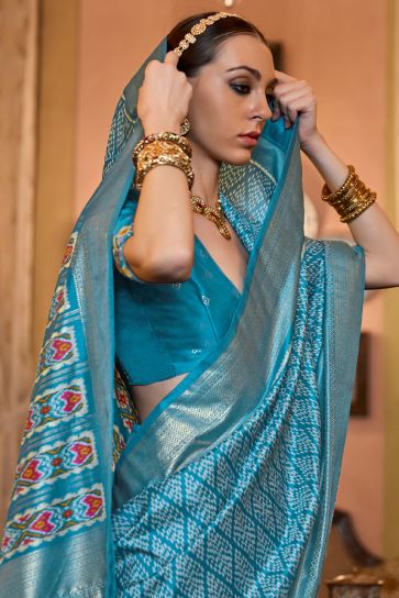 Charming Patola Silk Cyan Color Saree with Weaving Border