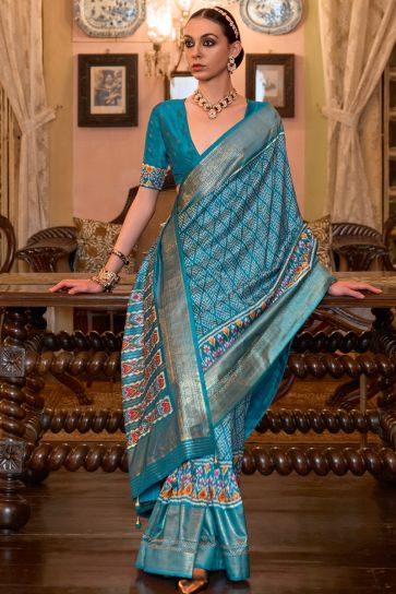 Charming Patola Silk Cyan Color Saree with Weaving Border