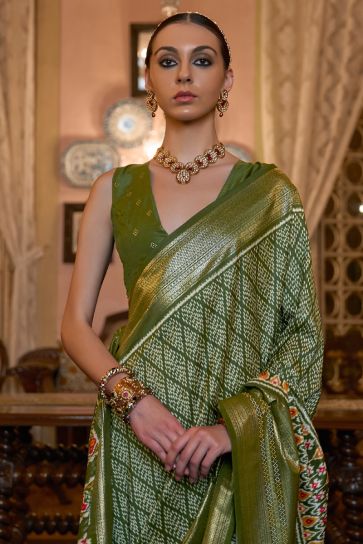 Bold and Beautiful Patola Silk Saree with Mehendi Green Color Printed Designs