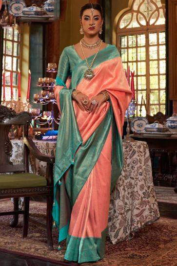 Engaging Peach Color Silk Fabric Saree With Weaving Work
