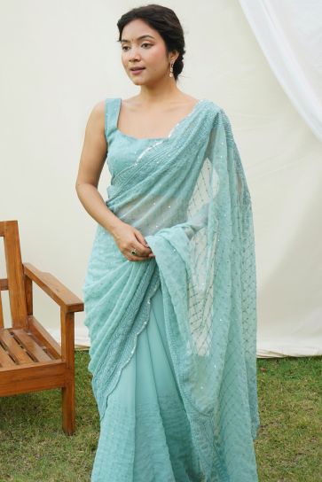 Sequins Work Soothing Festive Wear Georgette Saree In Cyan Color