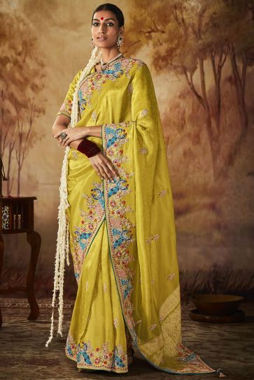 Attractive Embroidery Work Banarasi Kanjivaram Saree In Yellow Color