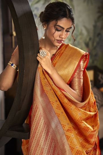 Weaving Designs On Flamboyant Festive Look Art Silk Saree In Orange Color