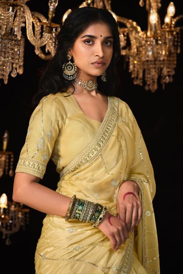 Embroidered Work On Yellow Color Sober Saree In Tissue Fabric