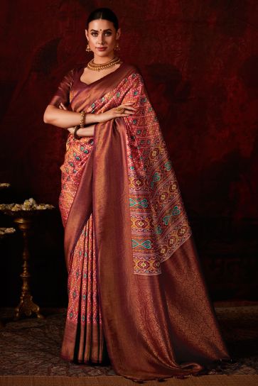 Soothing Patola Style Printed Silk Saree In Rust Color