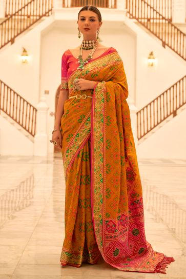 Weaving Work Imposing Banarsi Silk Patola Saree In Mustard Color