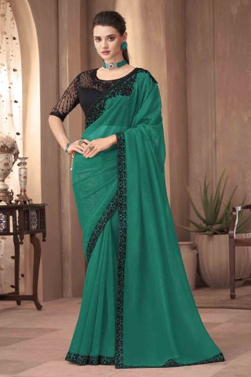 Silk Fabric Reception Wear Classic Lace Border Work Green Color Saree
