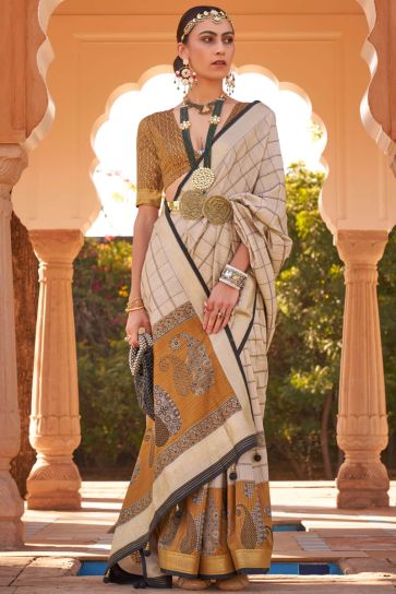 Festive Wear Beige Color Saree In Printed Patola Silk Fabric