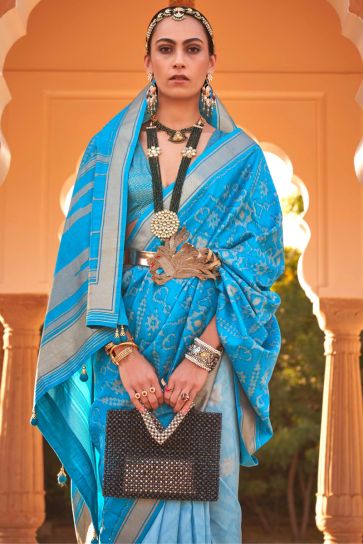 Printed Patola Silk Fabric Sky Blue Color Fancy Festive Wear Saree
