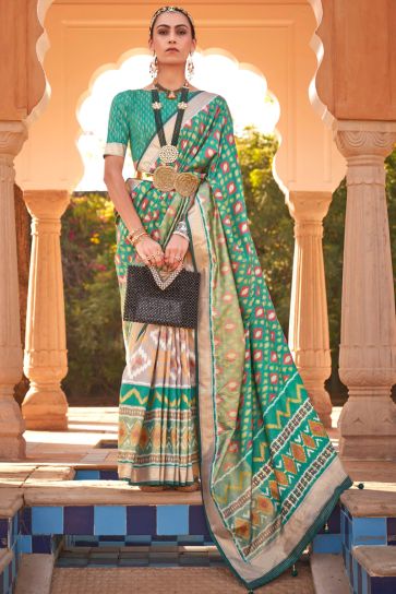 Printed Patola Silk Fabric Sea Green Color Festive Wear Saree