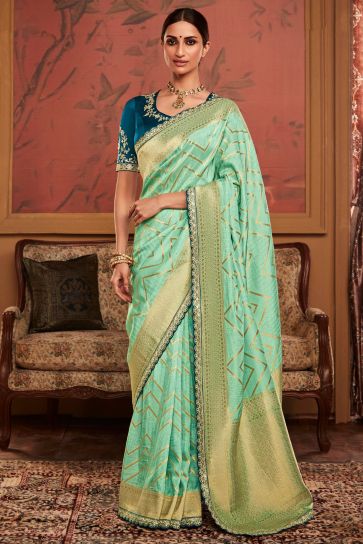 Dola Silk Fabric Weaving Work Sea Green Color Wedding Wear Designer Saree