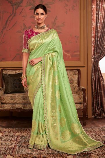 Dola Silk Fabric Green Color Weaving Work Festive Wear Trendy Saree