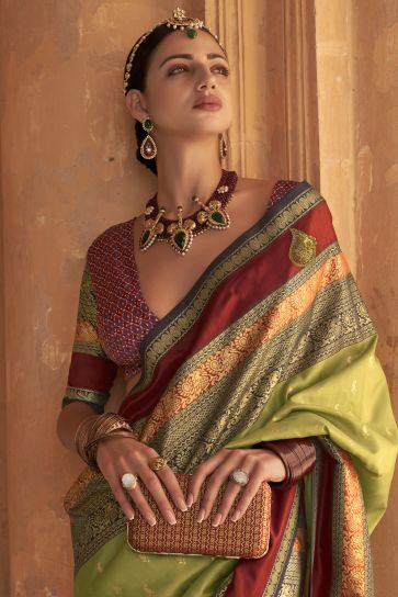 Kanjivaram Silk Fabric Wedding Wear Green Color Fancy Weaving Print Saree With Patola Design Blouse