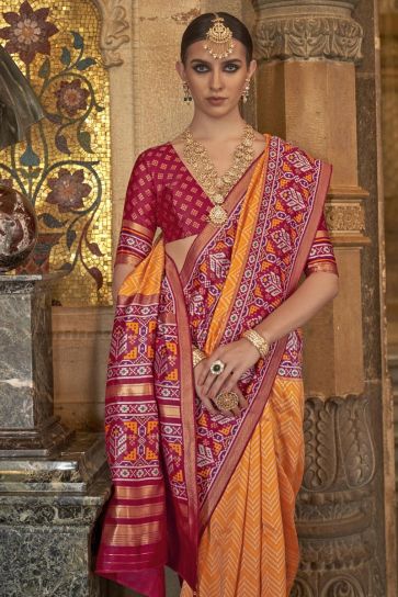 Attractive Printed Orange Color Art Silk Fabric Patola Saree