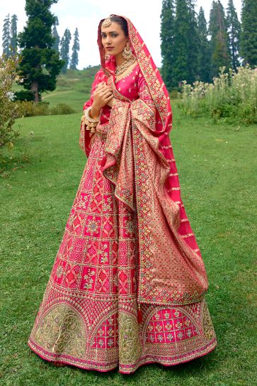 Embroidered Rani Color Bridal Lehenga In Silk Fabric With Designer Choli