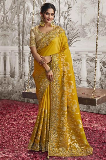 Delicate Yellow Color Heavy Embroidery Work Fancy Fabric Saree With Party Look Blouse
