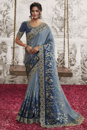 Dazzling Blue Color Fancy Fabric Heavy Embroidery Work Saree With Party Look Blouse