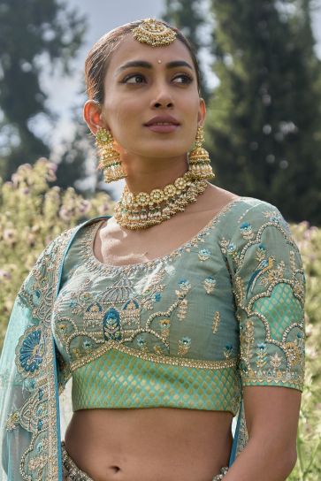 Embroidery Work Bridal Lehenga Choli In Sea Green Color Viscose Fabric