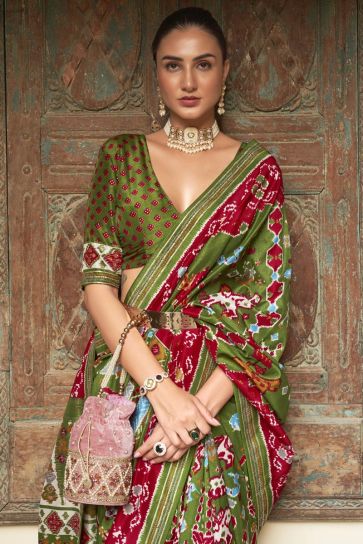 Fascinating Mehendi Green Color Art Silk Fabric Patola Printed Saree