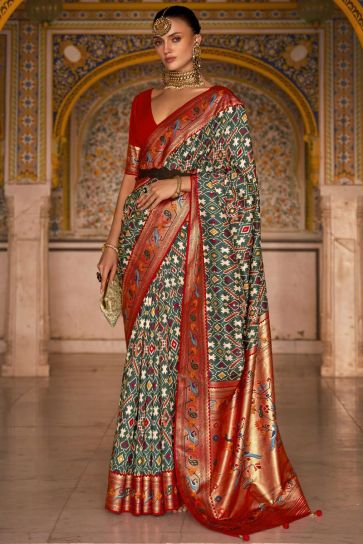 Green Color Patola Printed On Engrossing Saree In Art Silk Fabric