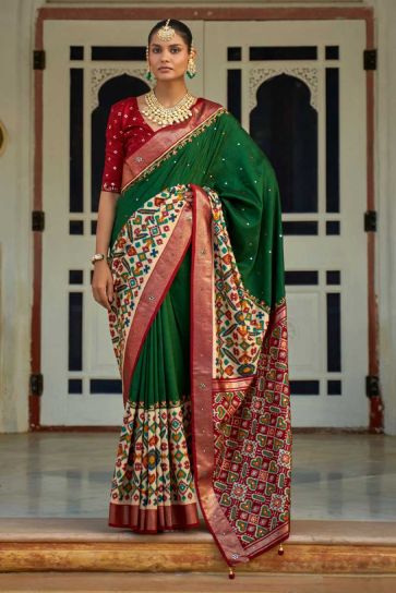 Patola Printed Lovely Art Silk Fabric Saree In Dark Green Color