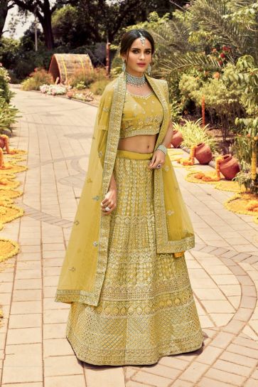 Art Silk Fabric Yellow Color Wedding Wear Bridal Lehenga With Embroidered Work
