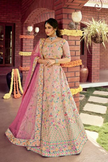 Art Silk Fabric Peach Color Wedding Wear Bridal Lehenga With Fascinating Embroidered Work