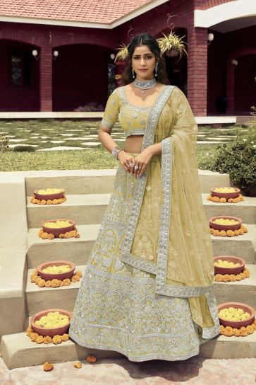 Tempting Art Silk Fabric Yellow Color Wedding Wear Bridal Lehenga With Embroidered Work