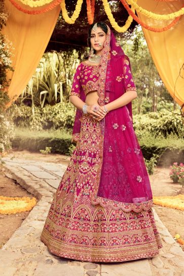 Art Silk Fabric Rani Color Wedding Wear Bridal Lehenga With Embroidered Work