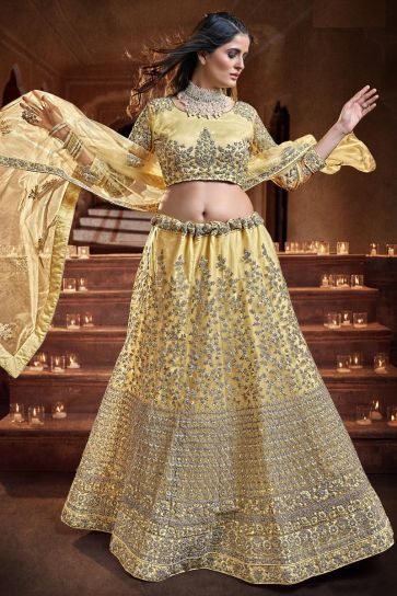 Glamorous Georgette And Net Sequins Work Lehenga Choli In Yellow Color