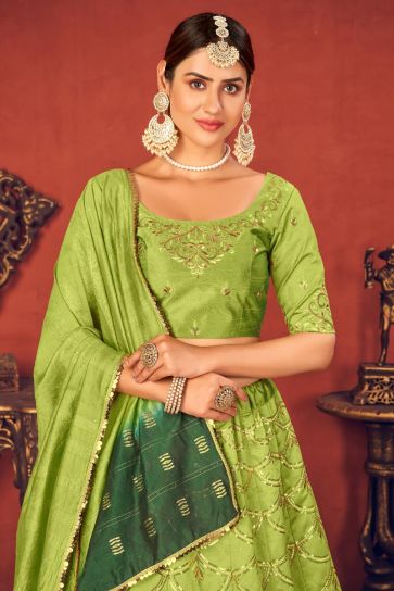 Wedding Wear Art Silk Fabric Embroidered Lehenga Choli In Green Color