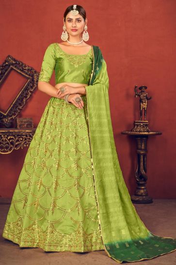 Wedding Wear Art Silk Fabric Embroidered Lehenga Choli In Green Color