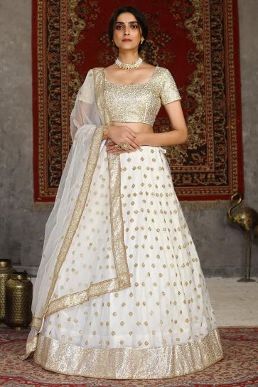 Sangeet Wear Net Fabric Sequins Work Lehenga Choli In White Color