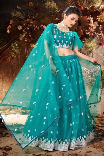 Sangeet Wear Cyan Color Elegant Lehenga Choli In Net Fabric