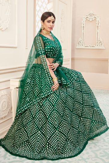 Green Color Net Fabric Sangeet Function Wear Embroidered Lehenga