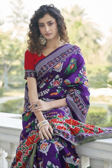 Radiant Weaving Work On Purple Color Art Silk Fabric Sangeet Wear Patola Style Saree