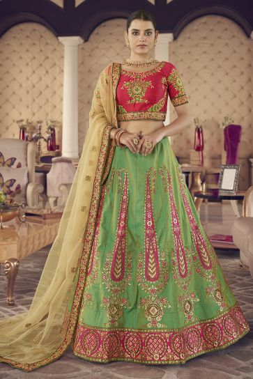 Enriching Designer Thread Embroidered Wedding Wear Lehenga Choli In Green Color Jacquard Silk Fabric