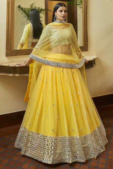 Sangeet Wear Net Fabric Chic Yellow Color Embroidered Lehenga Choli