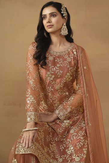Dazzling Net Fabric Peach Color Embroidered Palazzo Suit