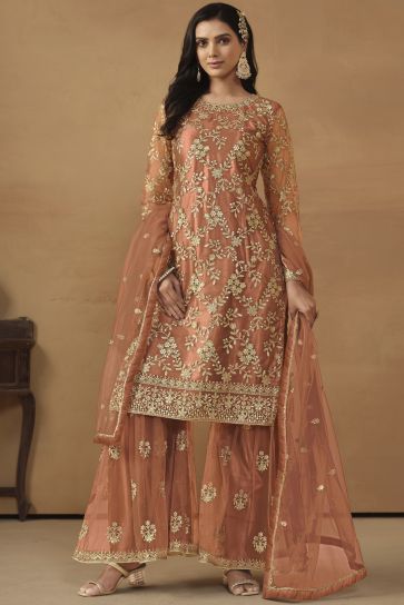 Dazzling Net Fabric Peach Color Embroidered Palazzo Suit