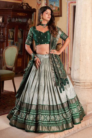 Attractive Art Silk Fabric Green Color Lehenga With Foil Printed Work