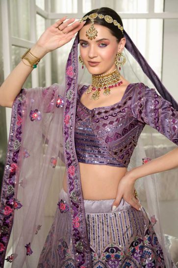 Purple Color Engrossing Embroidered Wedding Wear Lehenga In Silk Fabric