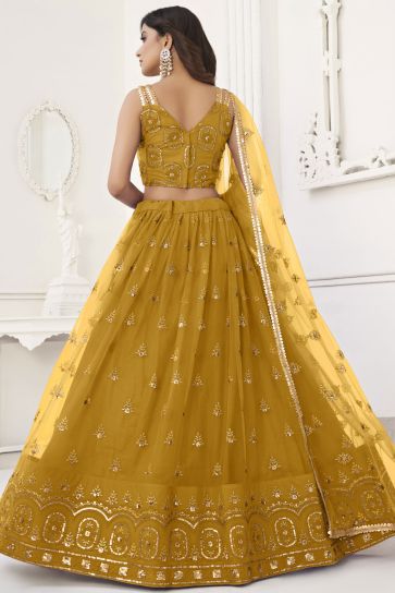 Sequins Embroidered Mustard Color Net Fabric Trendy Lehenga For Sangeet Function
