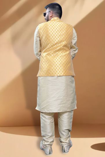 Stunning Function Wear Cream Kurta Pyjama With Yellow Color Jacket In Silk Fabric