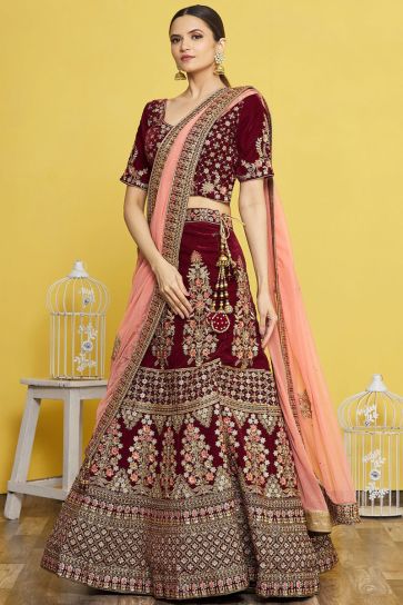 DEEP WINE BRIDAL LEHENGA SET WITH ALL OVER GOLD AND ROSE GOLD EMBROIDERY  PAIRED WITH A MATCHING HAND EMBROIDERED DUPATTA AND CUMMERBUND. - Seasons  India