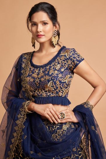 Sangeet Wear Navy Blue Color Net Fabric Mesmeric Lehenga With Embroidered Work