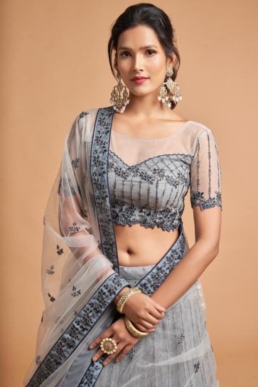 Net Fabric Sangeet Wear Grey Color Provocative Lehenga With Embroidered Work