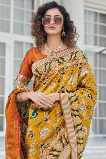 Patola Silk Fabric Beguiling Mustard Color Weaving Work Saree