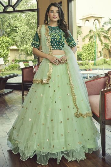 Creative Embroidered Work On Lehenga In Sea Green Color Net Fabric
