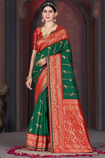 Weaving Work Imposing Function Wear Silk Saree In Dark Green Color